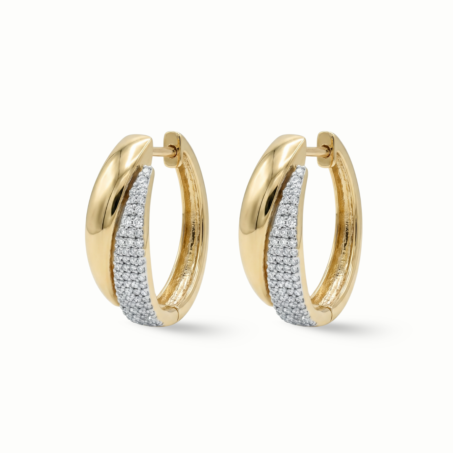 Pavé diamond huggie earrings 18K gold women Dubai UAE
