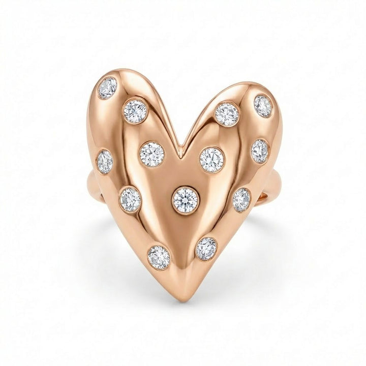 Rose gold heart-shaped earring with embedded diamonds on a white background